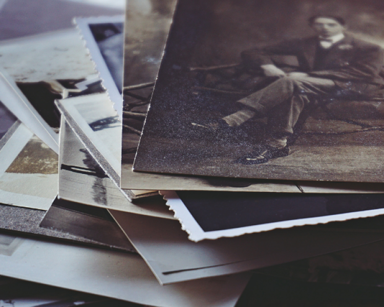 Stack of historic photos and documents